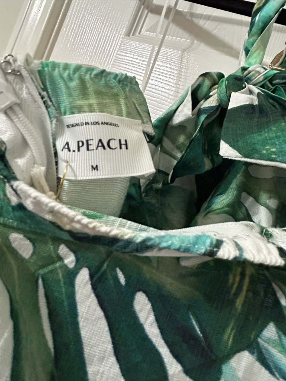 A. Peach Tropical Leaf Halter Wide Leg Jumpsuit with Pockets - Picture 9 of 11